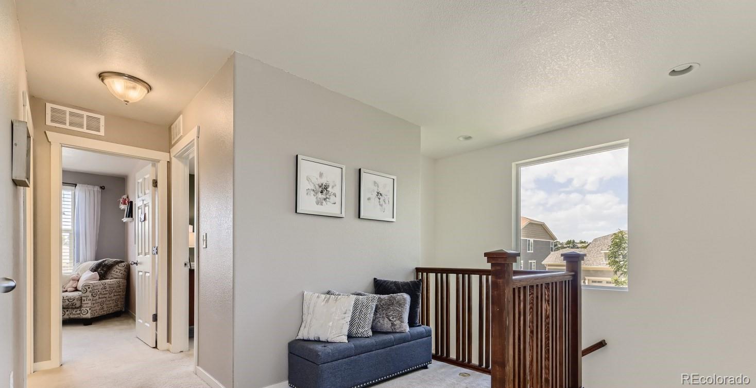 17021 White Alba Lane Parker, CO 80134 - Photo 17 of 21 a view of a livingroom with furniture and windows
