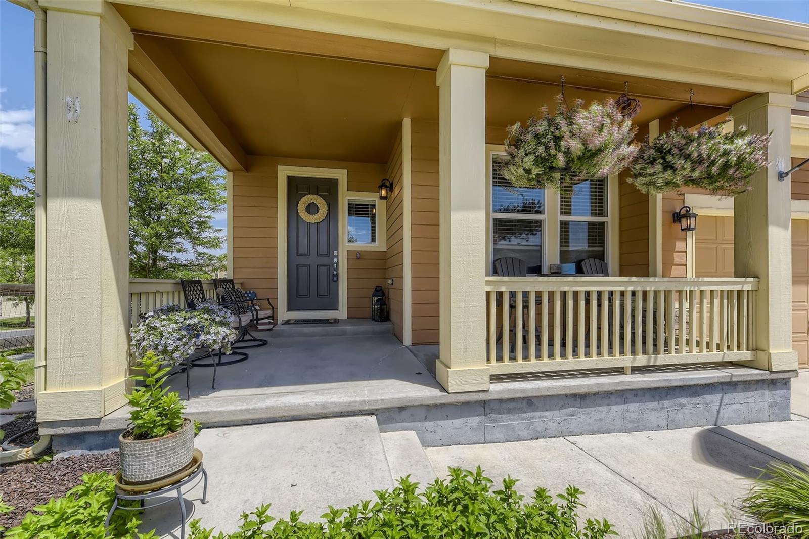 17021 White Alba Lane Parker, CO 80134 - Photo 2 of 21 a front view of a house with a porch