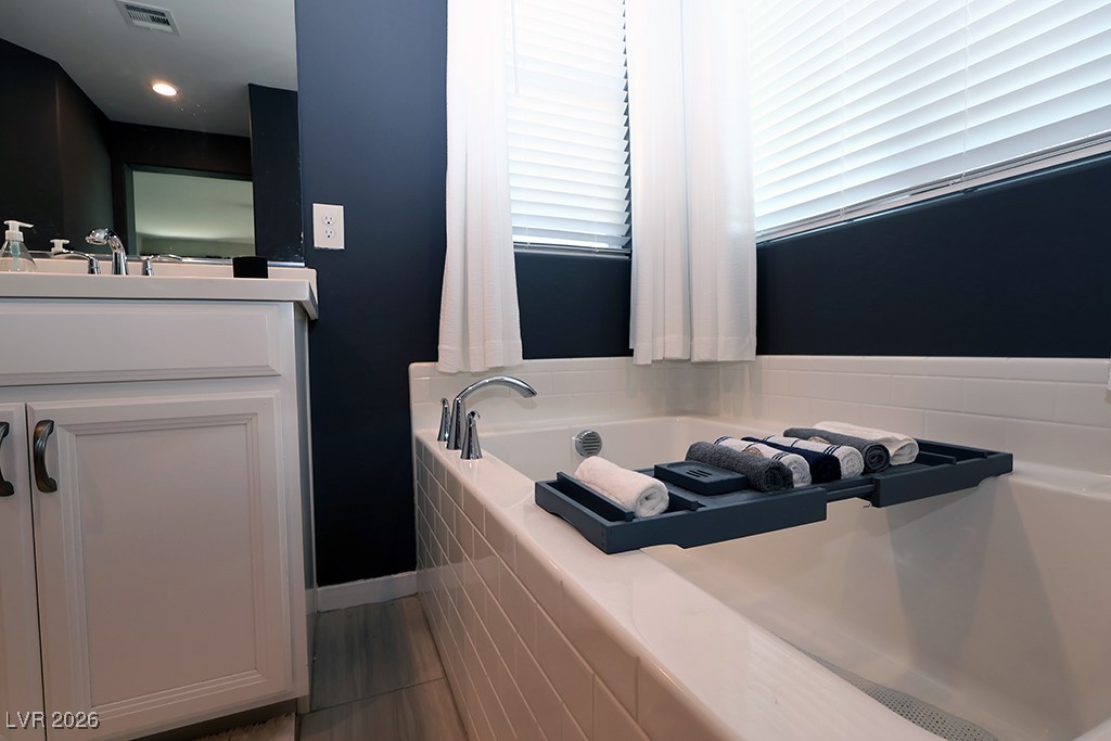 764 Rogue Wave Street Las Vegas, NV 89138 - Photo 17 of 36 Full bath with vanity and a garden tub