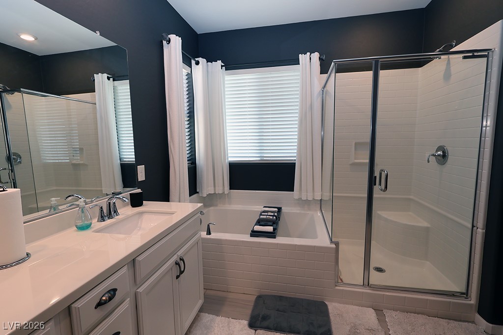 764 Rogue Wave Street Las Vegas, NV 89138 - Photo 18 of 36 Full bath with a garden tub, vanity, and a shower stall