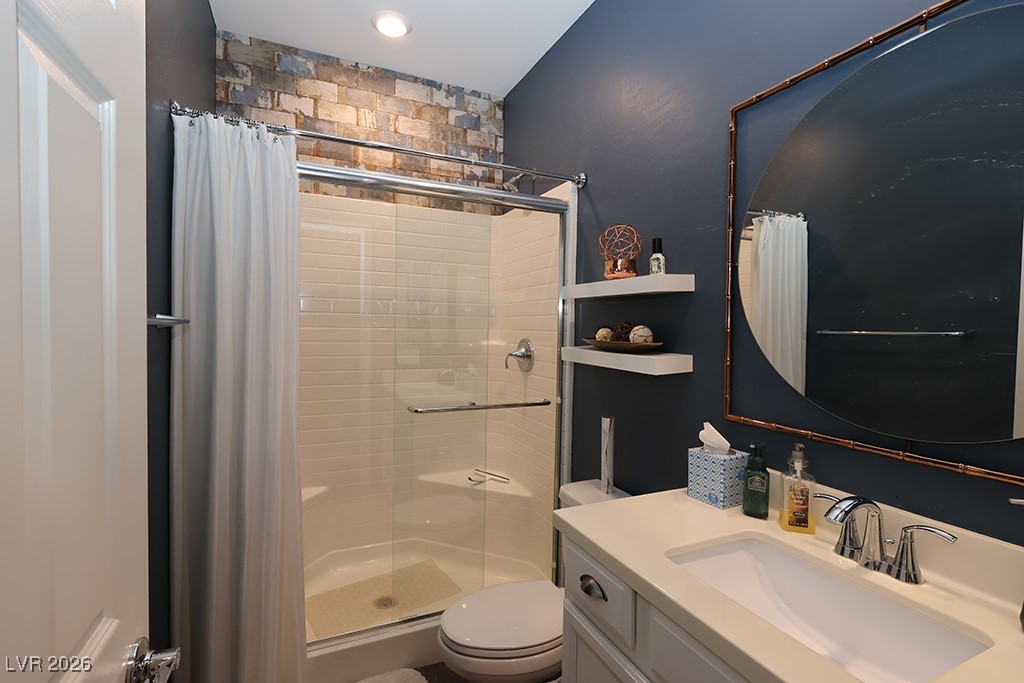 764 Rogue Wave Street Las Vegas, NV 89138 - Photo 25 of 36 Full bathroom featuring a shower stall and vanity