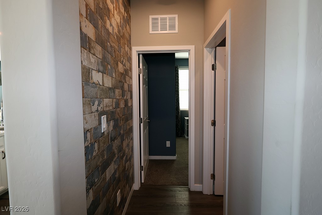 764 Rogue Wave Street Las Vegas, NV 89138 - Photo 27 of 36 Hall with dark wood-type flooring and baseboards