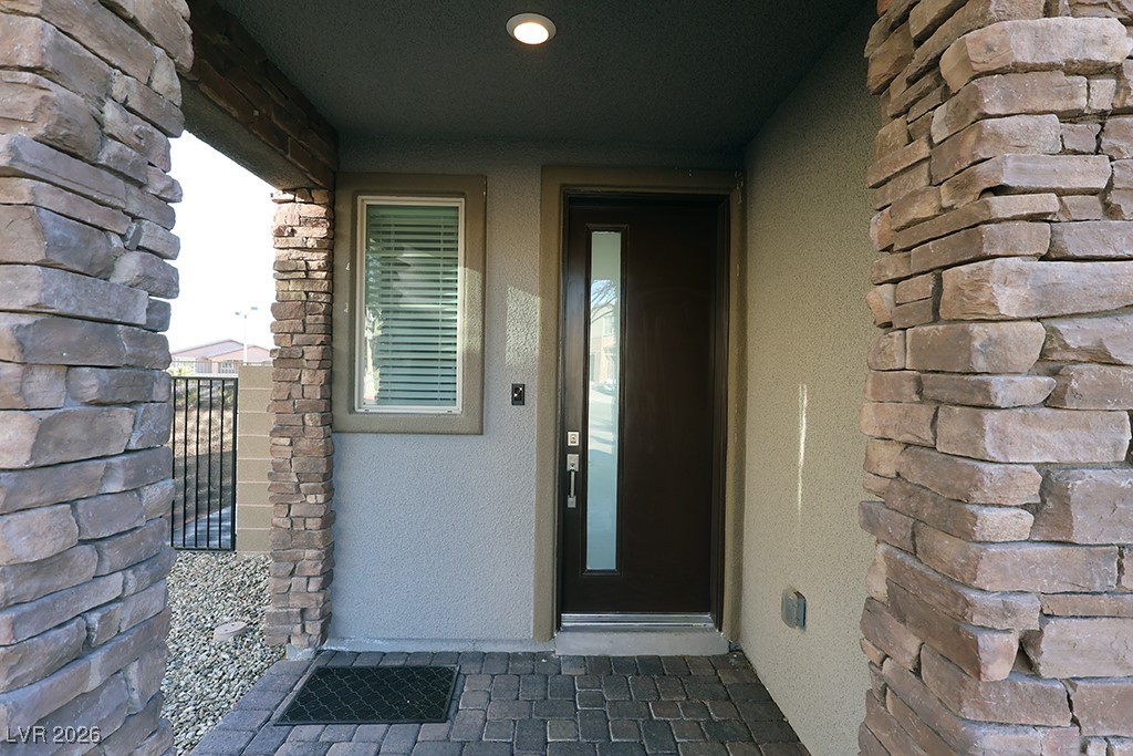 764 Rogue Wave Street Las Vegas, NV 89138 - Photo 3 of 36 Property entrance featuring stucco siding
