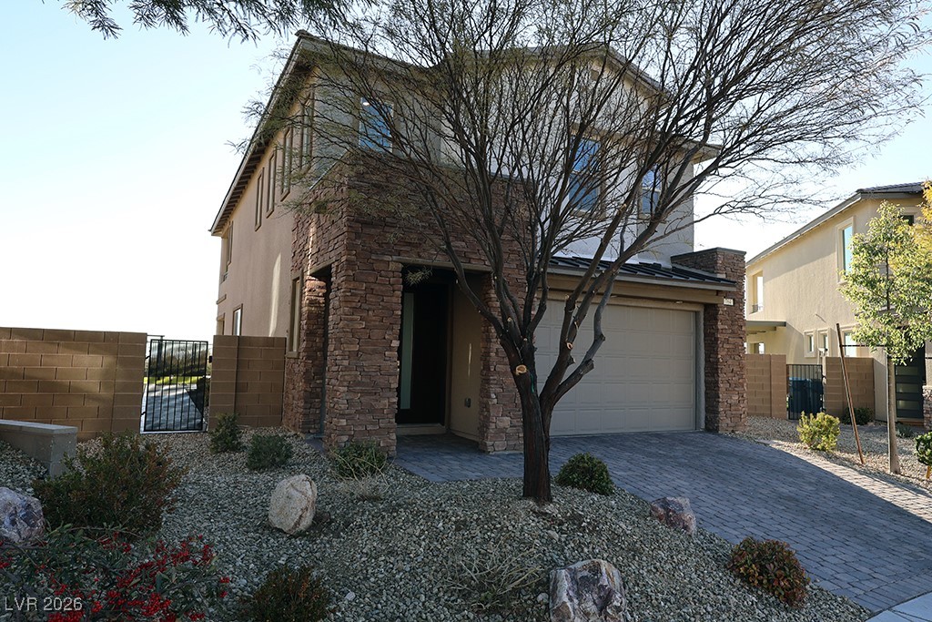 764 Rogue Wave Street Las Vegas, NV 89138 - Photo 34 of 36 View of front of property with a gate and decorative driveway