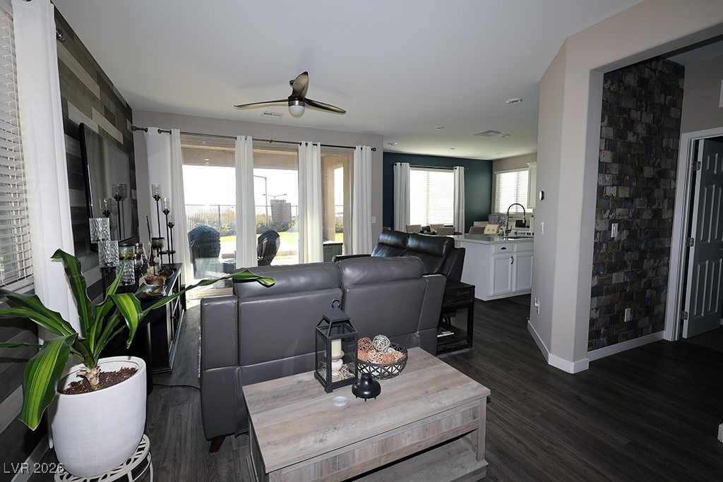 764 Rogue Wave Street Las Vegas, NV 89138 - Photo 4 of 36 Living room with dark wood-type flooring and a ceiling fan