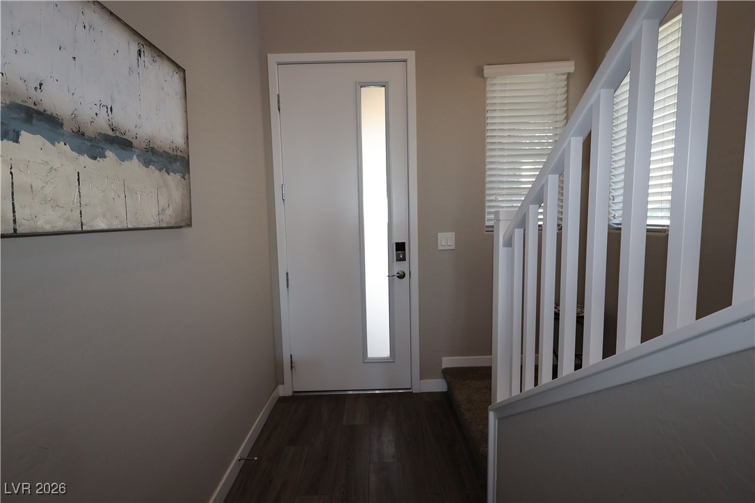 764 Rogue Wave Street Las Vegas, NV 89138 - Photo 5 of 36 Entrance foyer featuring baseboards and dark wood finished floors