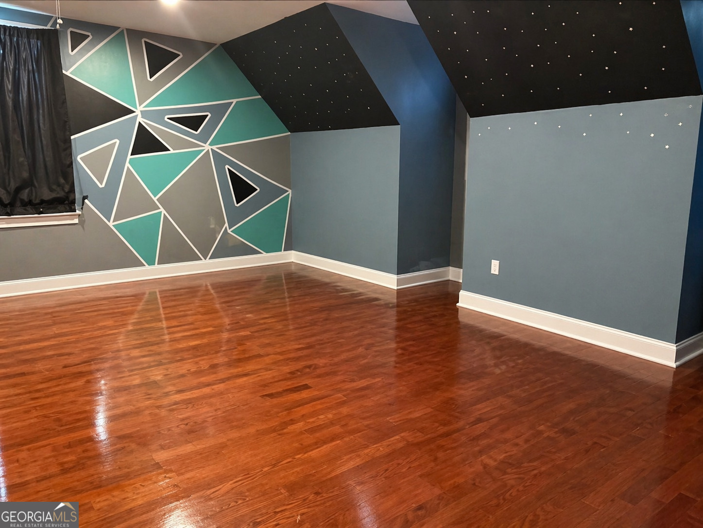 1024 Holly Estates Road Tarrytown, GA 30470 - Photo 12 of 15 a view of an empty room with wooden floor