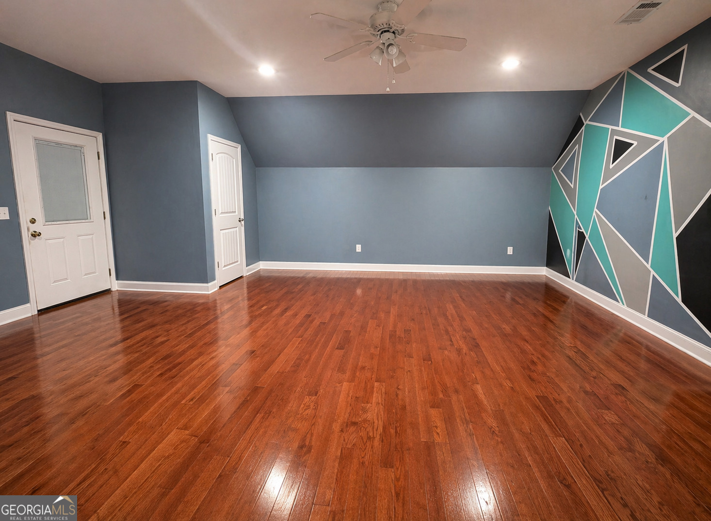 1024 Holly Estates Road Tarrytown, GA 30470 - Photo 14 of 15 a view of an empty room with wooden floor and a window