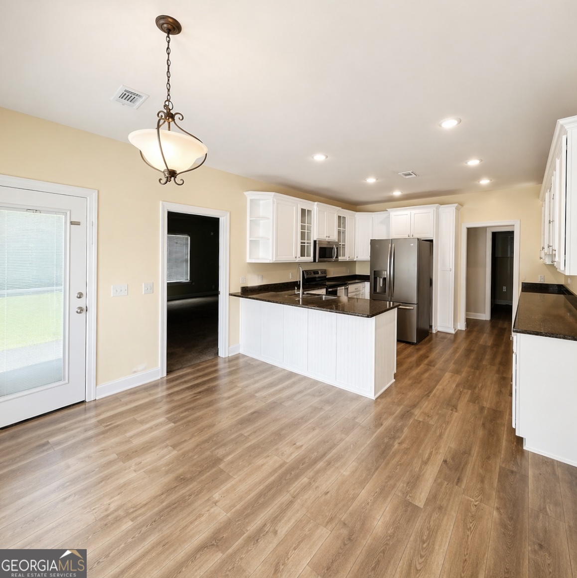 1024 Holly Estates Road Tarrytown, GA 30470 - Photo 2 of 15 a view of kitchen with sink microwave and refrigerator