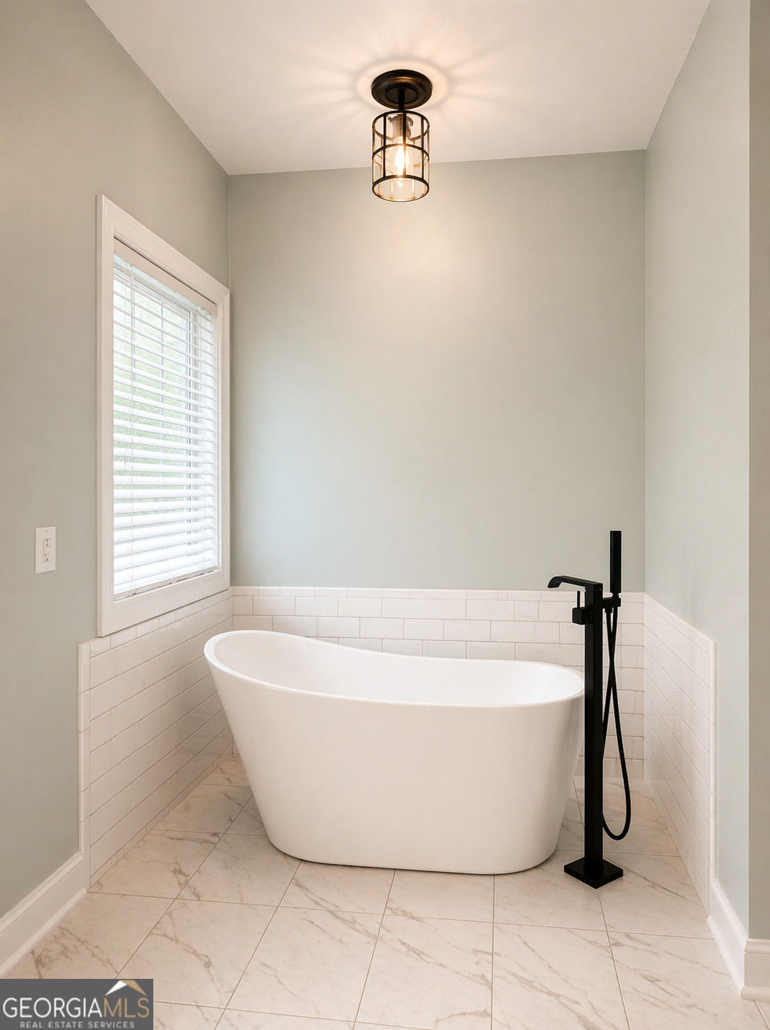 1024 Holly Estates Road Tarrytown, GA 30470 - Photo 6 of 15 a white bath tub sitting in a bathroom