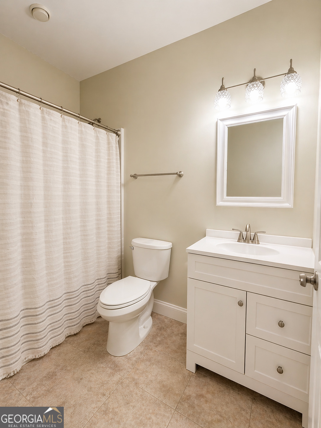 1024 Holly Estates Road Tarrytown, GA 30470 - Photo 9 of 15 a bathroom with a toilet sink and mirror