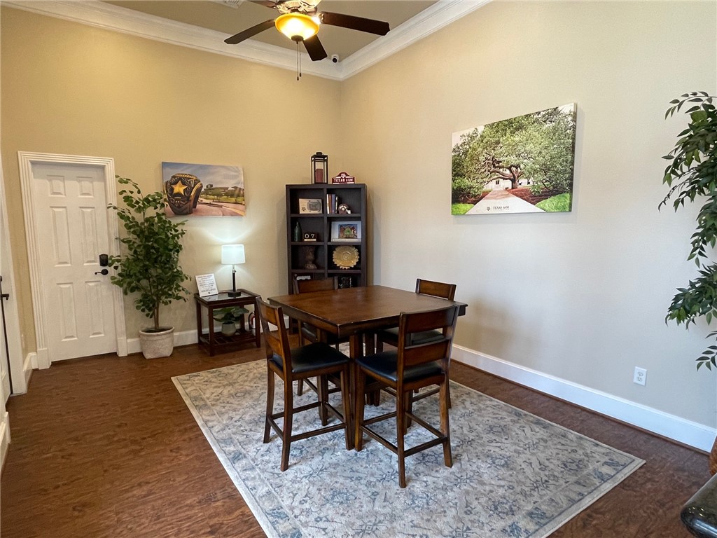1198 Jones-Butler Road, Unit 2706 College Station, TX 77840 - Photo 13 of 17 a view of a dining room with furniture and wooden floor