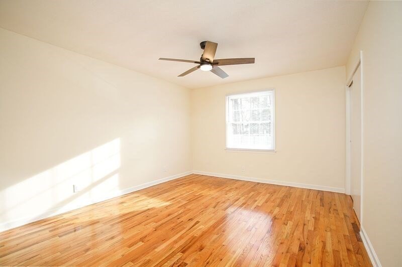 58 Williamsburg Drive, Unit 58 Springfield, MA 01108 - Photo 13 of 15 a view of empty room with wooden floor and fan