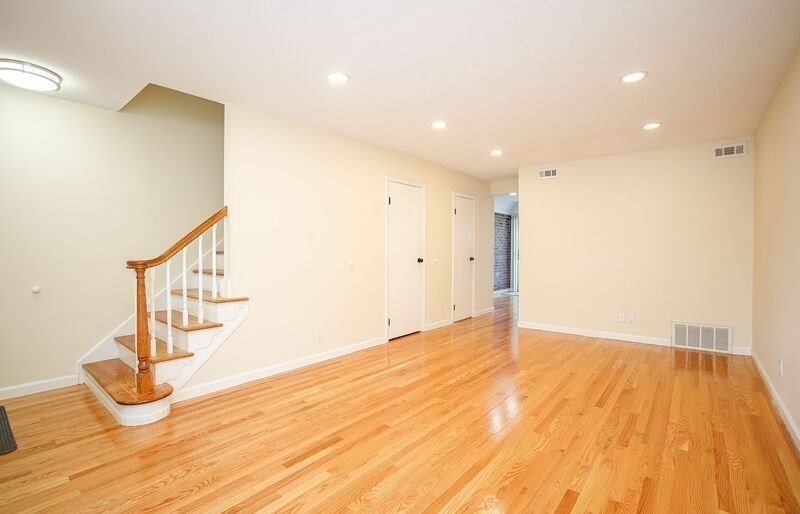 58 Williamsburg Drive, Unit 58 Springfield, MA 01108 - Photo 2 of 15 a view of empty room with wooden floor