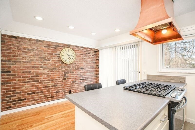 58 Williamsburg Drive, Unit 58 Springfield, MA 01108 - Photo 4 of 15 a view of a kitchen with a sink and a stove top oven