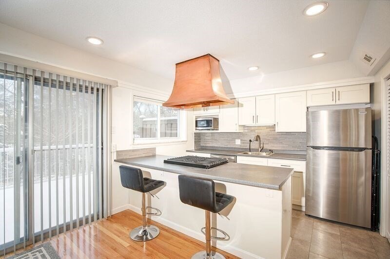 58 Williamsburg Drive, Unit 58 Springfield, MA 01108 - Photo 6 of 15 a kitchen that has a cabinets a sink and a refrigerator