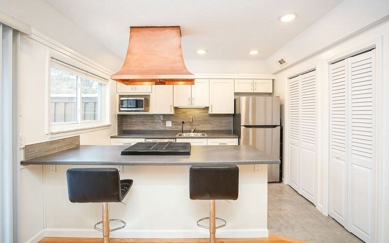58 Williamsburg Drive, Unit 58 Springfield, MA 01108 - Photo 7 of 15 a kitchen with stainless steel appliances granite countertop a refrigerator and a stove top oven