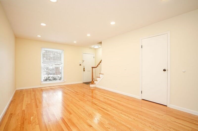58 Williamsburg Drive, Unit 58 Springfield, MA 01108 - Photo 10 of 15 a view of empty room with wooden floor and fan