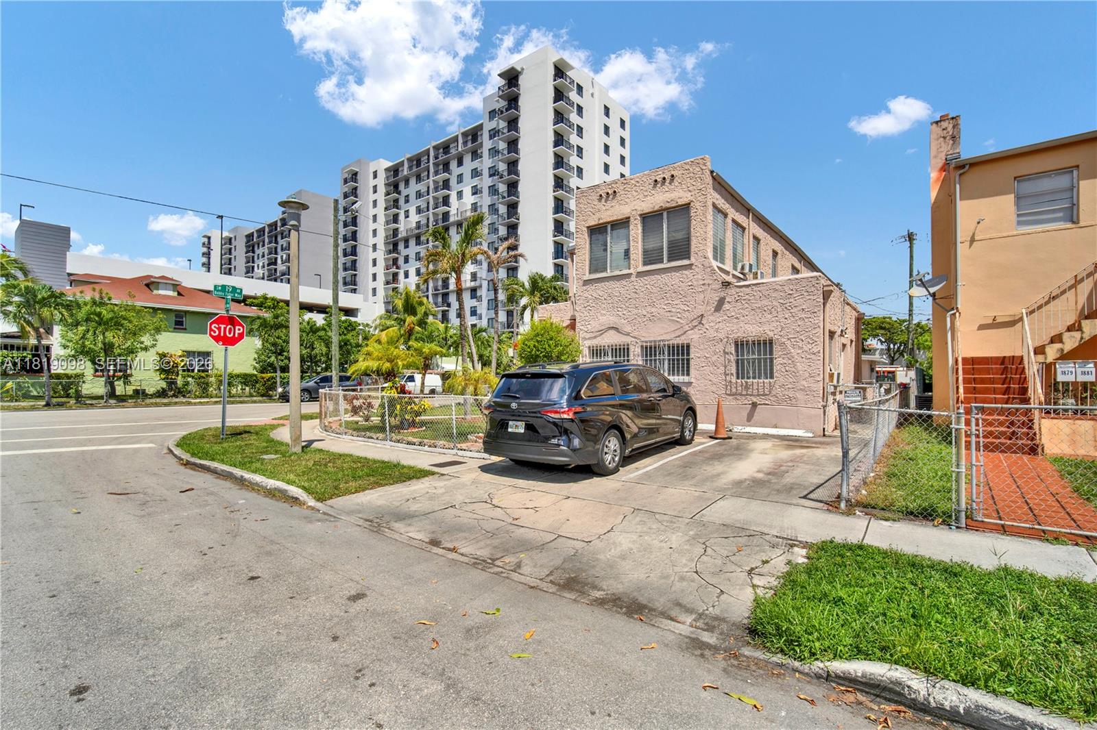 829 Southwest 19th Avenue Miami, FL 33135 - Photo 10 of 54 a view of a house with a patio and a yard