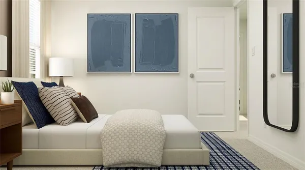 a bedroom with a bed couch and window