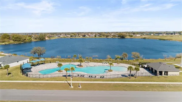 a view of a swimming pool with a patio