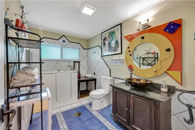 a utility room with dryer and washer