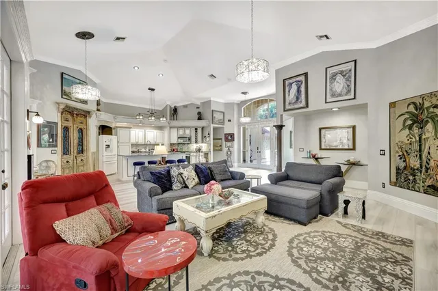 a large kitchen with cabinets and chairs