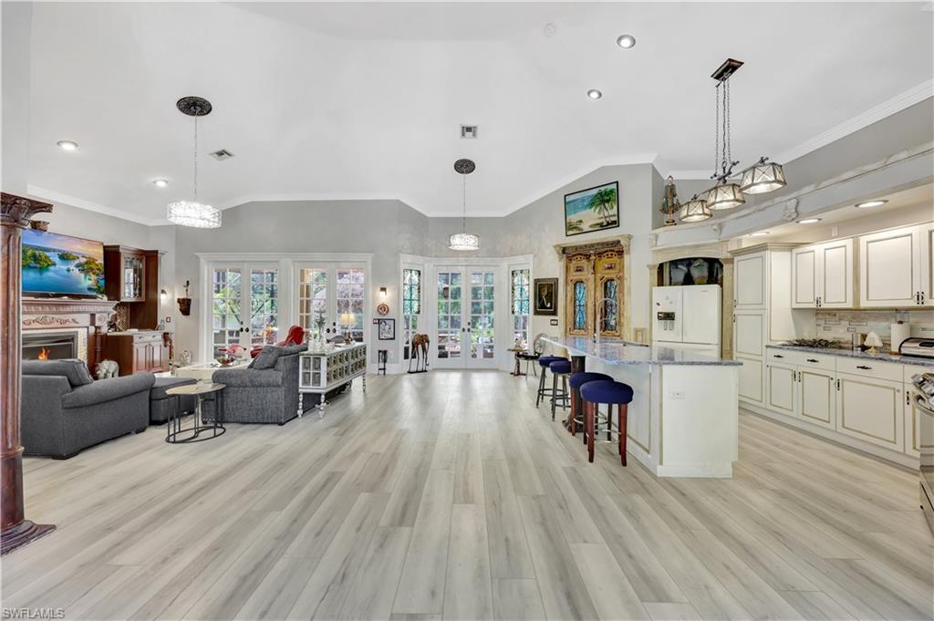 1904 Bethany Place Naples, FL 34109 - Photo 26 of 26 a living room with furniture and a wooden floor