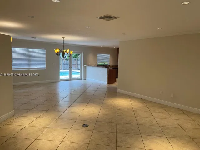 a view of hallway with chandelier