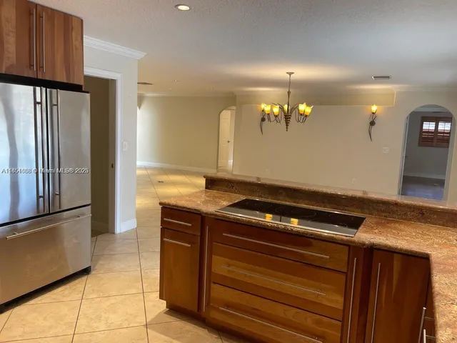 a view of kitchen island with cabinets