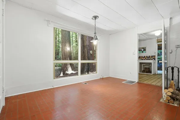 a view of an empty room with a window