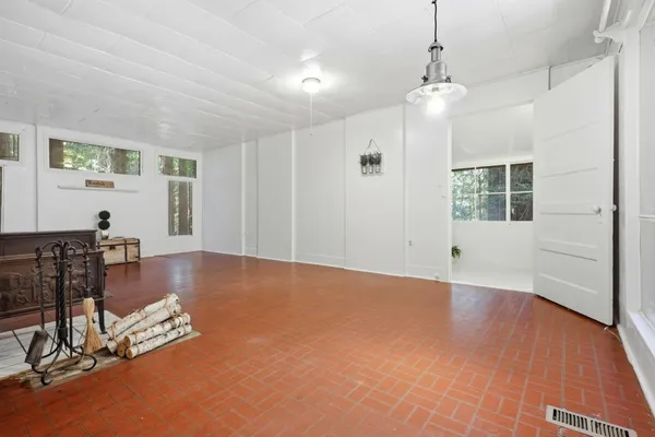a view of a livingroom with furniture and wooden floor