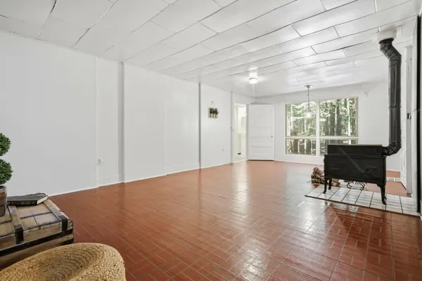 a view of livingroom with furniture window and wooden floor