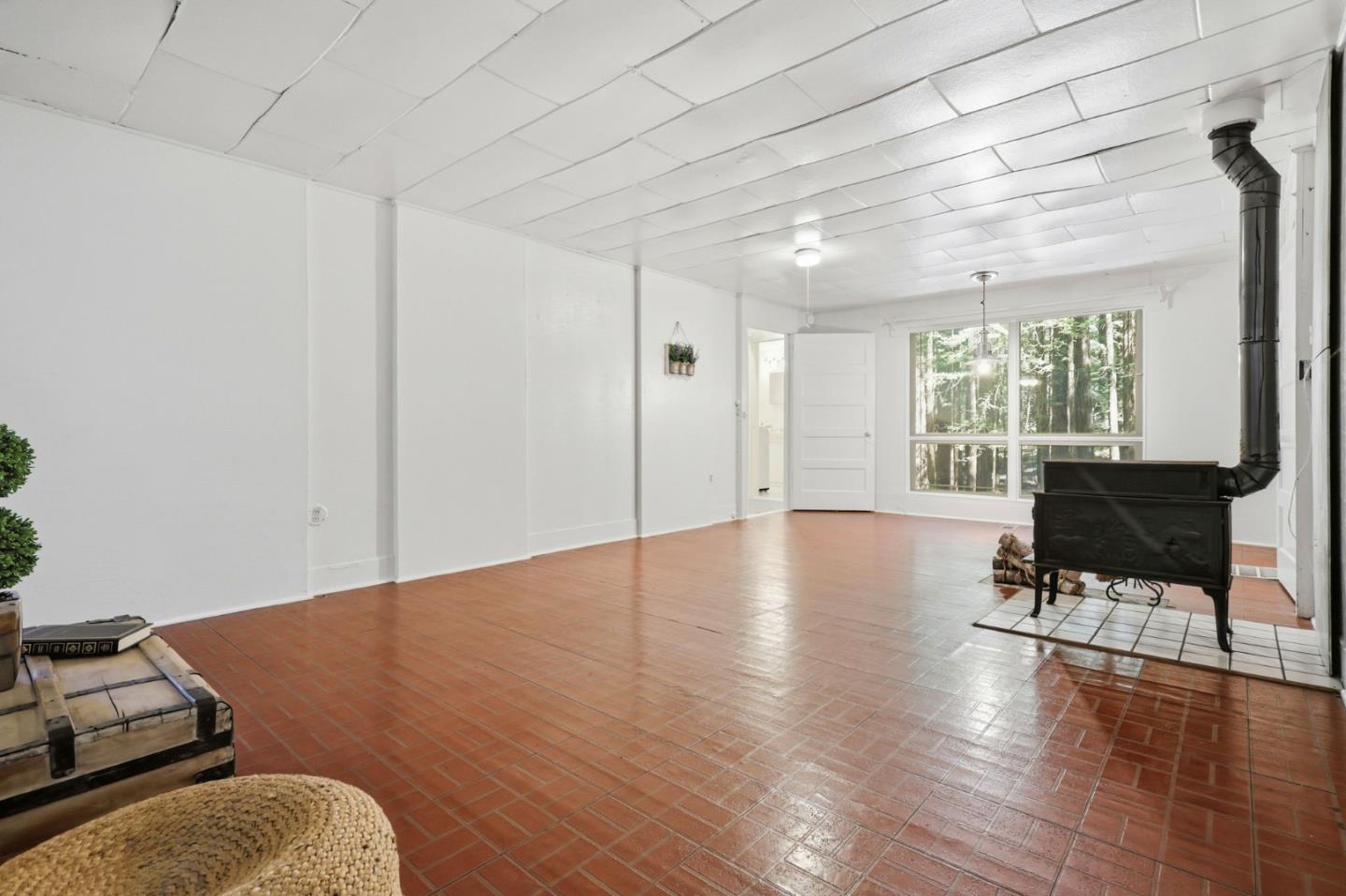 155 Native Sons Road Woodside, CA 94062 - Photo 17 of 42 a view of livingroom with furniture window and wooden floor