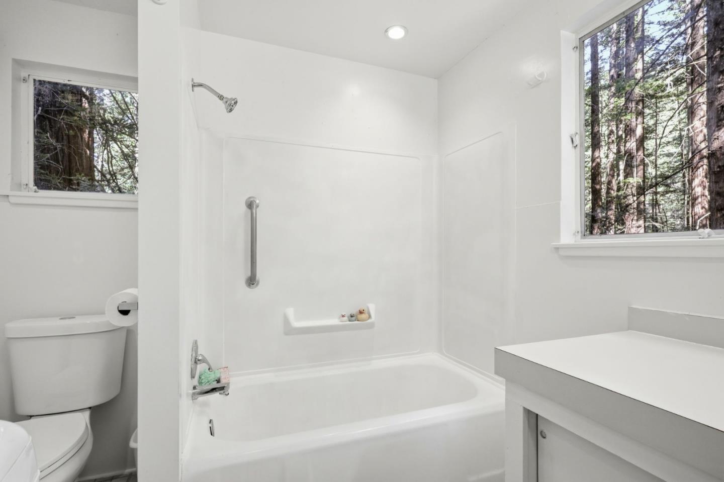 155 Native Sons Road Woodside, CA 94062 - Photo 28 of 42 a white bath tub sitting next to a white toilet