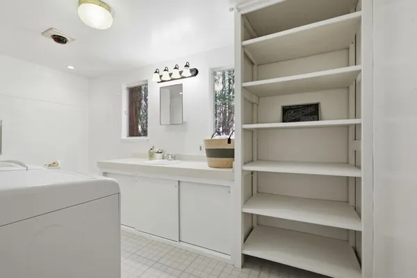a bathroom with a double vanity sink