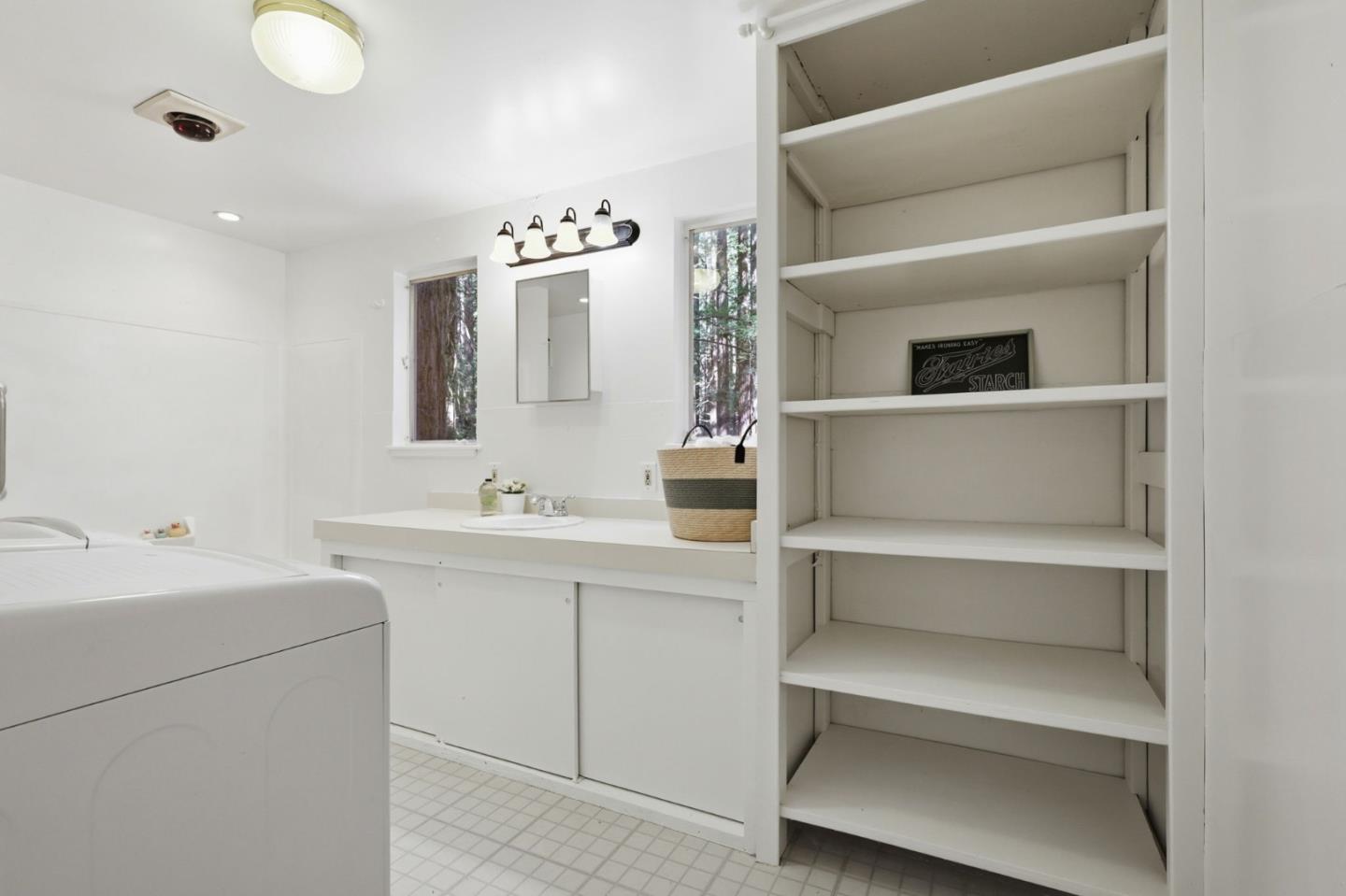 155 Native Sons Road Woodside, CA 94062 - Photo 29 of 42 a bathroom with a double vanity sink