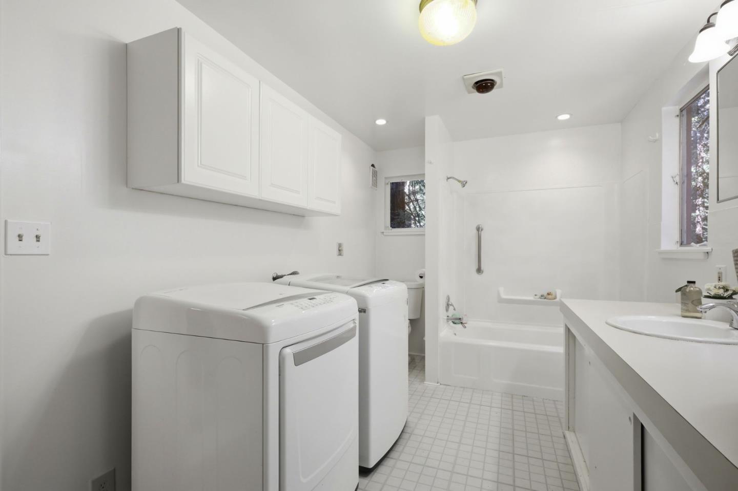 155 Native Sons Road Woodside, CA 94062 - Photo 30 of 42 a view of a sink and dishwasher with white cabinets