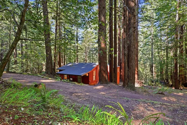 a backyard of a house with barbeque oven