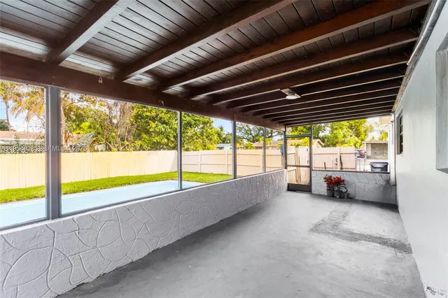 a view of an empty room with a large window