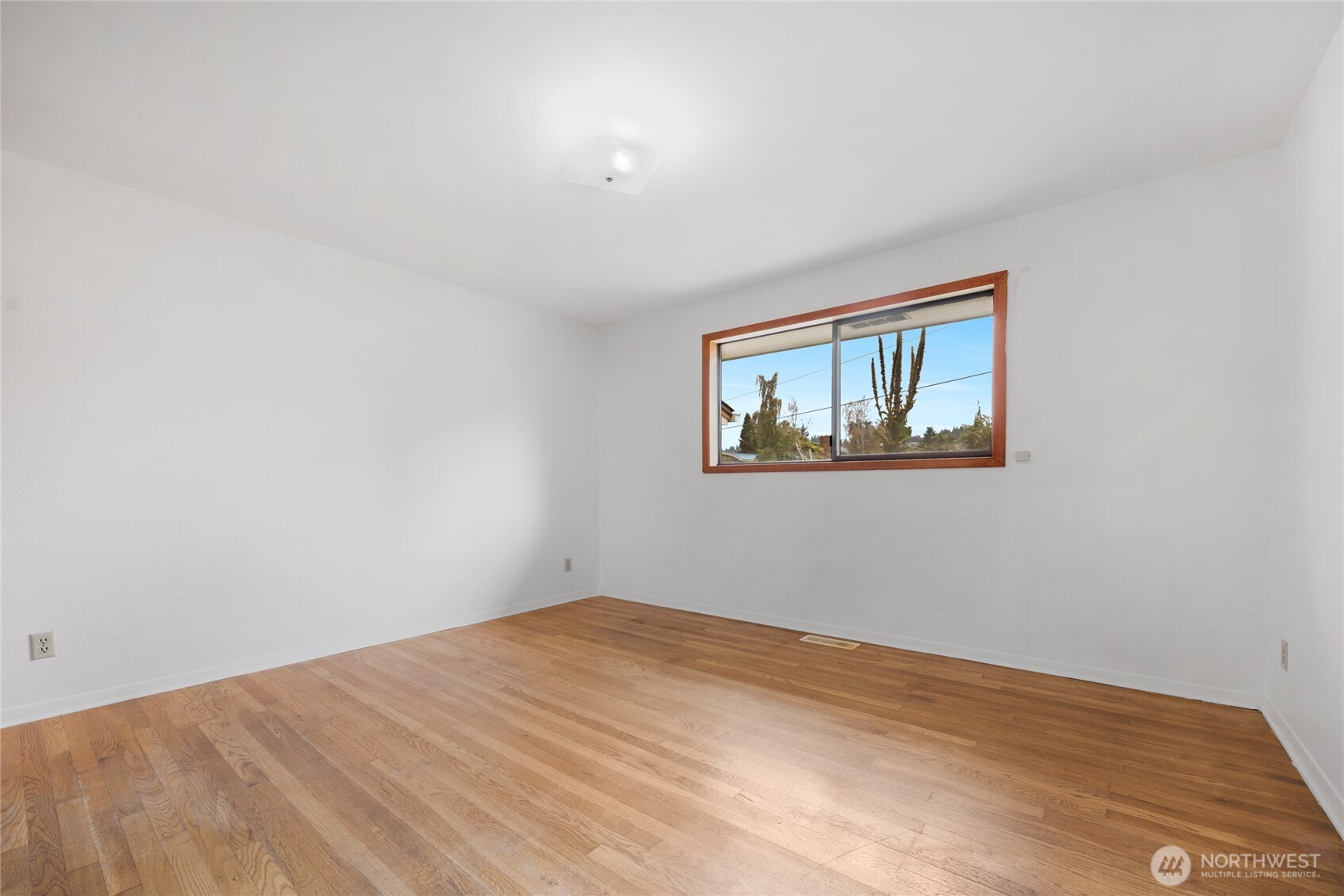 611 3rd Avenue North Edmonds, WA 98020 - Photo 15 of 28 a view of empty room with wooden floor
