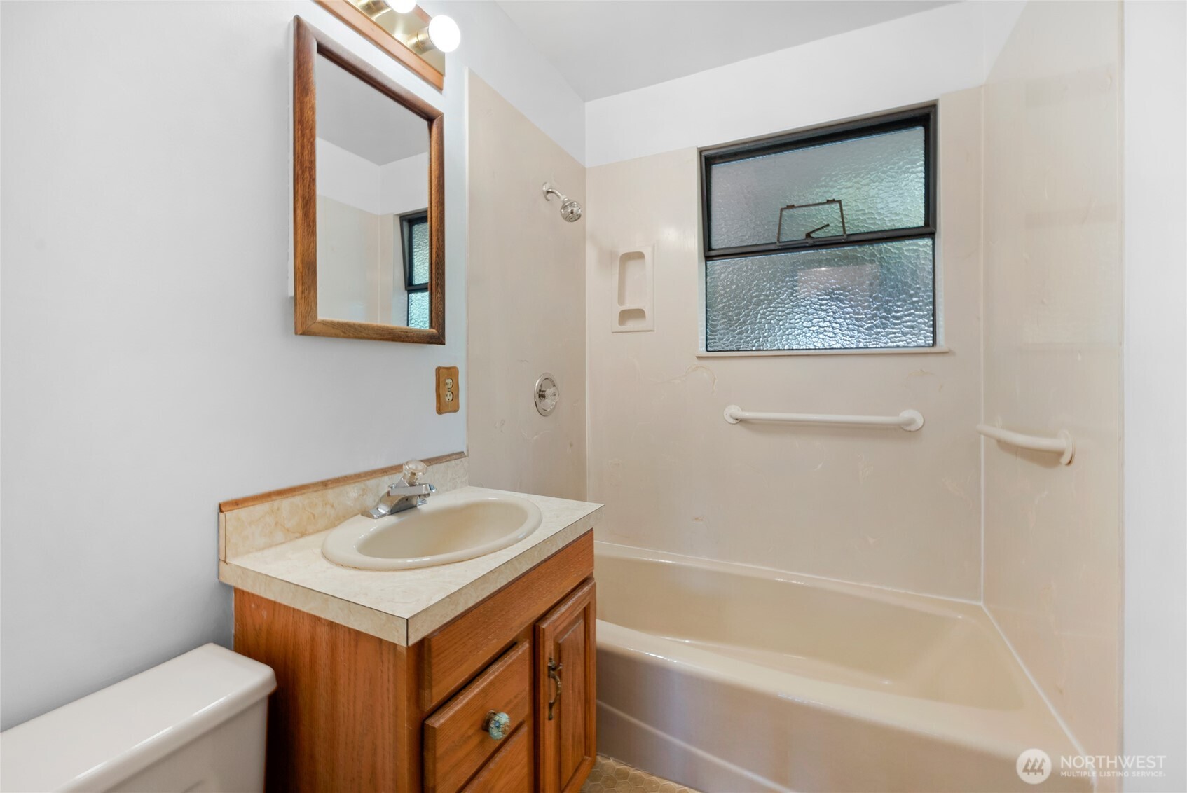 611 3rd Avenue North Edmonds, WA 98020 - Photo 19 of 28 a bathroom with a sink and a mirror