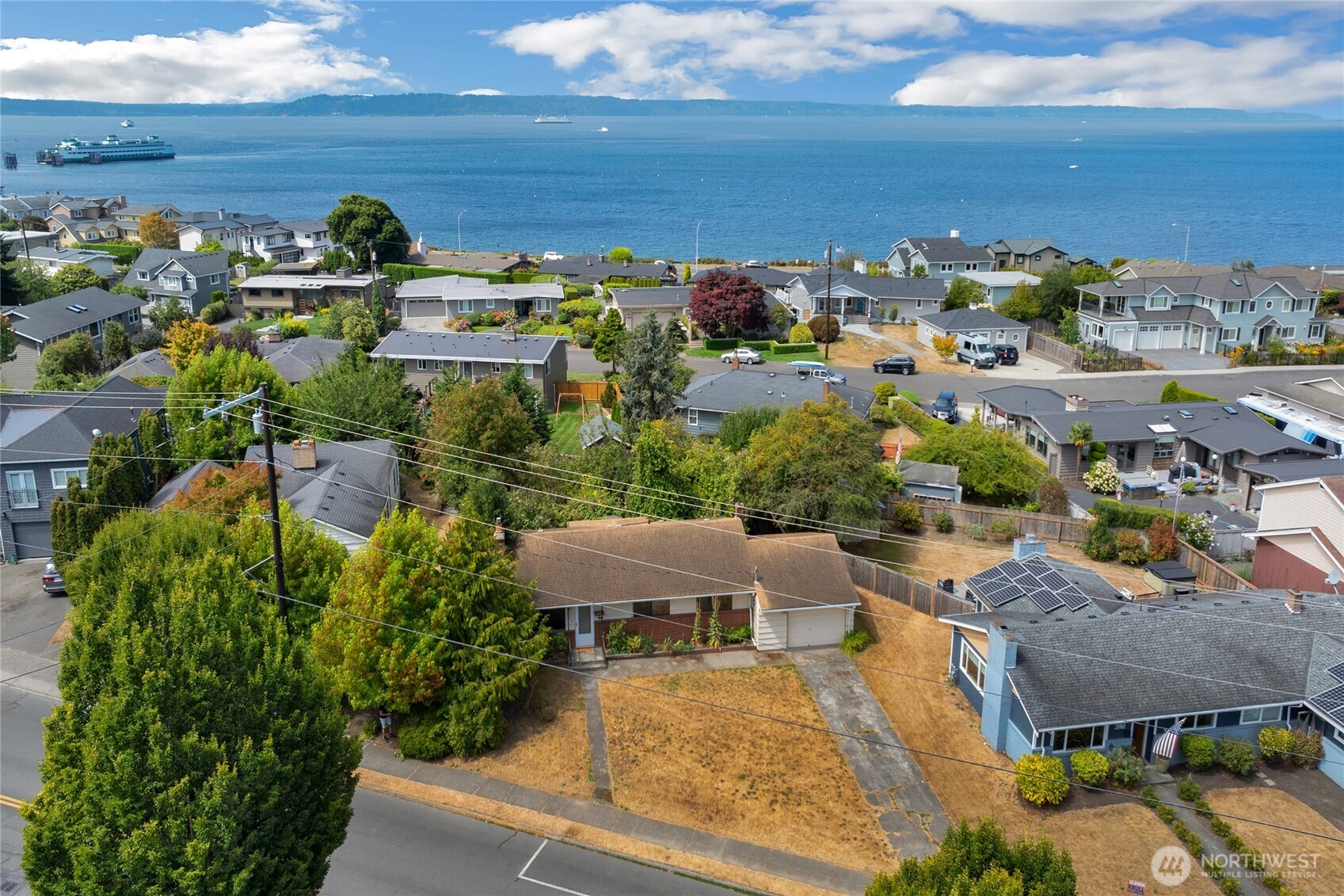 611 3rd Avenue North Edmonds, WA 98020 - Photo 26 of 28 a view of a house with a yard and ocean view