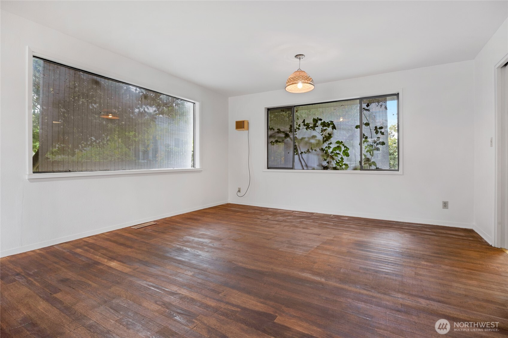 611 3rd Avenue North Edmonds, WA 98020 - Photo 8 of 28 a view of an empty room with wooden floor and window