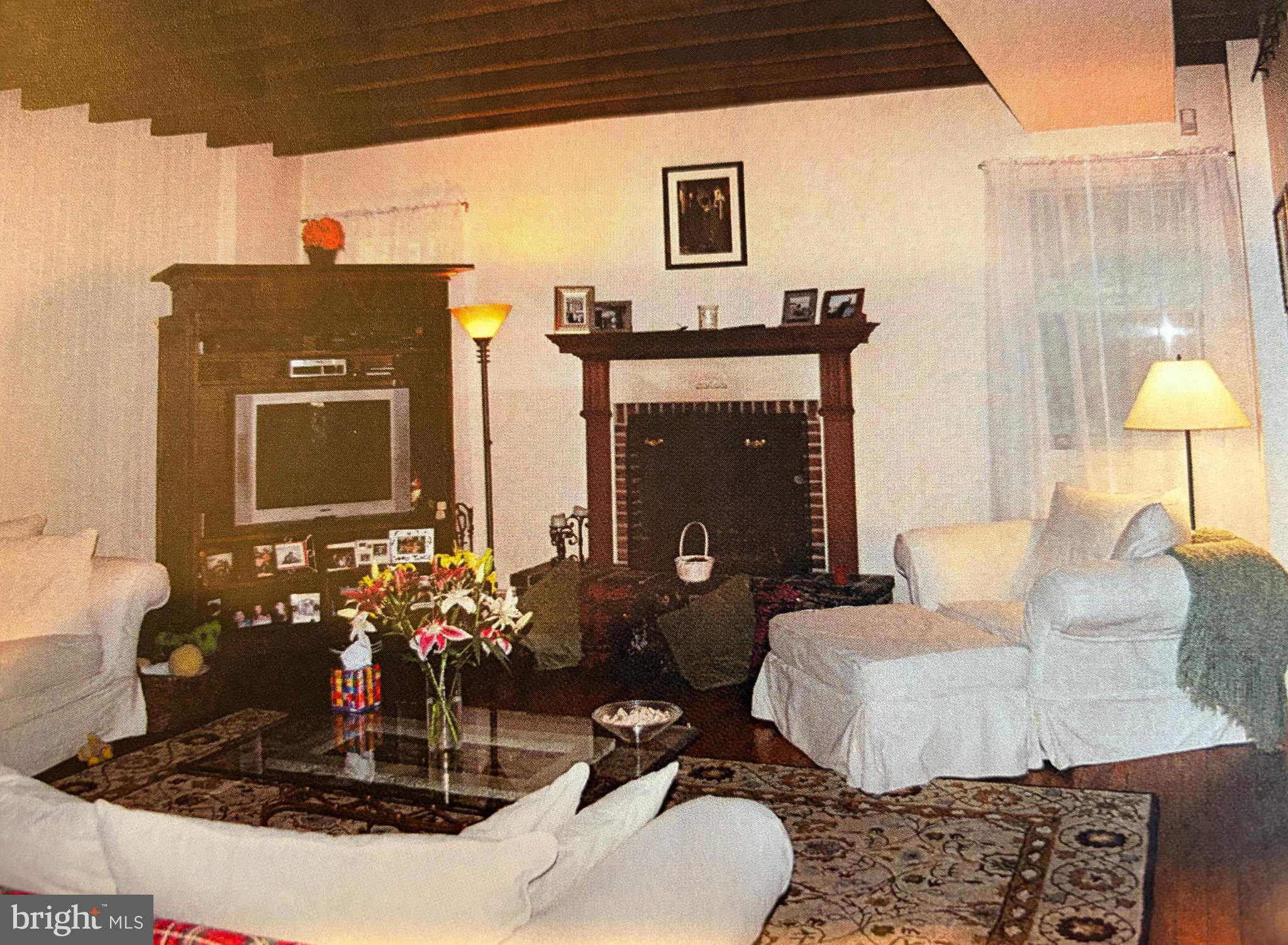 1 Private Way Wayne, PA 19087 - Photo 4 of 9 a living room with furniture and a fireplace