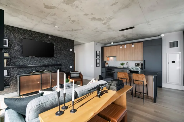 a living room with furniture and a flat screen tv