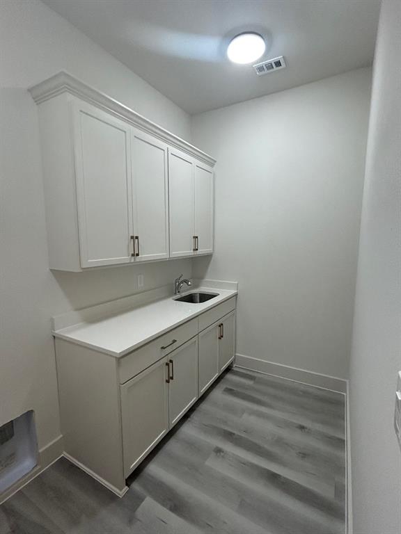 415 East Burks Street Pilot Point, TX 76258 - Photo 13 of 13 a room with a sink cabinets and utility room