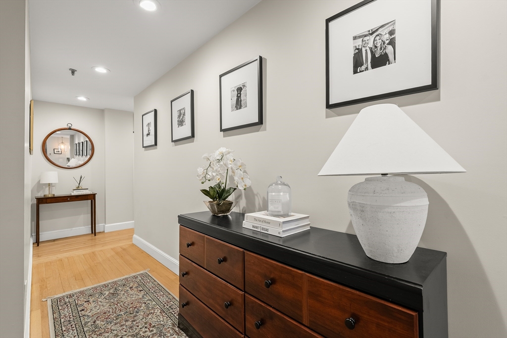 350 North Street, Unit 200 Boston, MA 02113 - Photo 13 of 22 a room with painting on the wall and a lamp