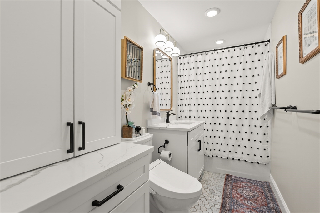 350 North Street, Unit 200 Boston, MA 02113 - Photo 15 of 22 a bathroom with a toilet a sink and a shower