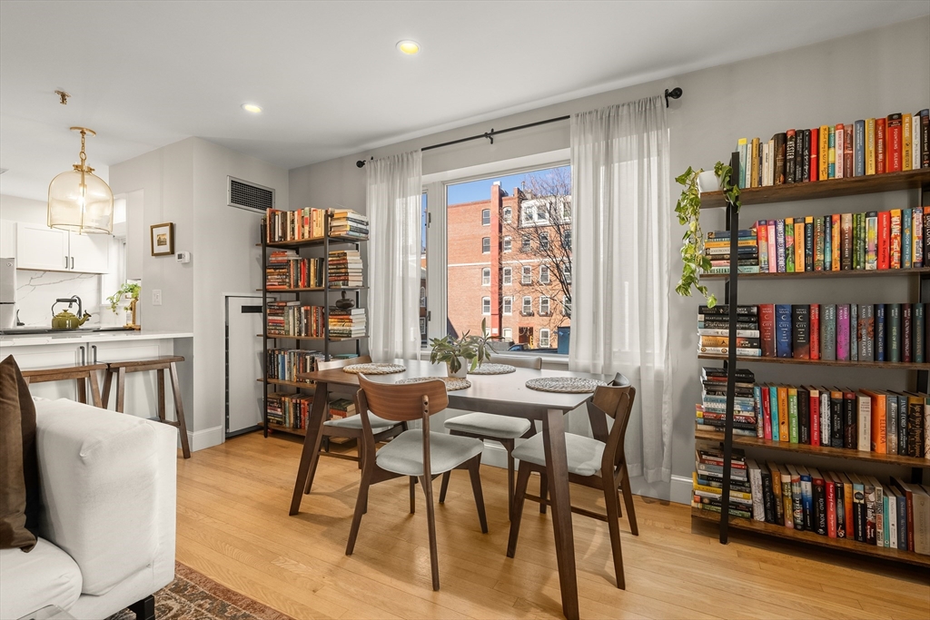 350 North Street, Unit 200 Boston, MA 02113 - Photo 4 of 22 a view of a livingroom with furniture and a book shelf